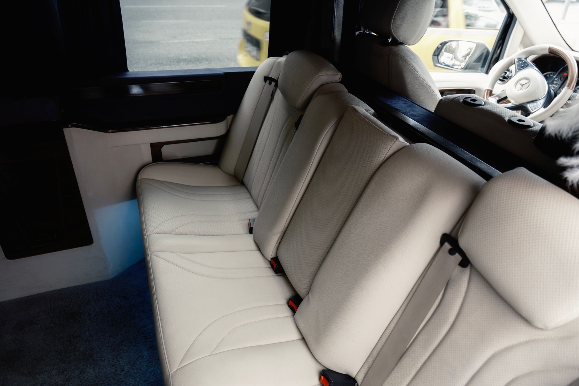 Explore the luxury seating and upholstery of a modern passenger van interior, perfect for travel.