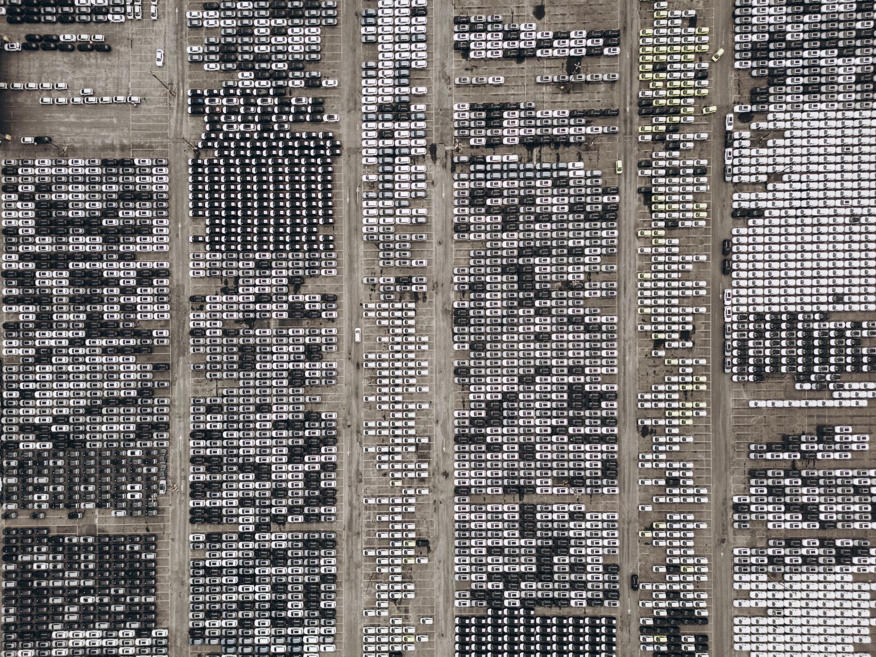 High-angle aerial shot of a massive car parking area, filled with vehicles in Brazil.