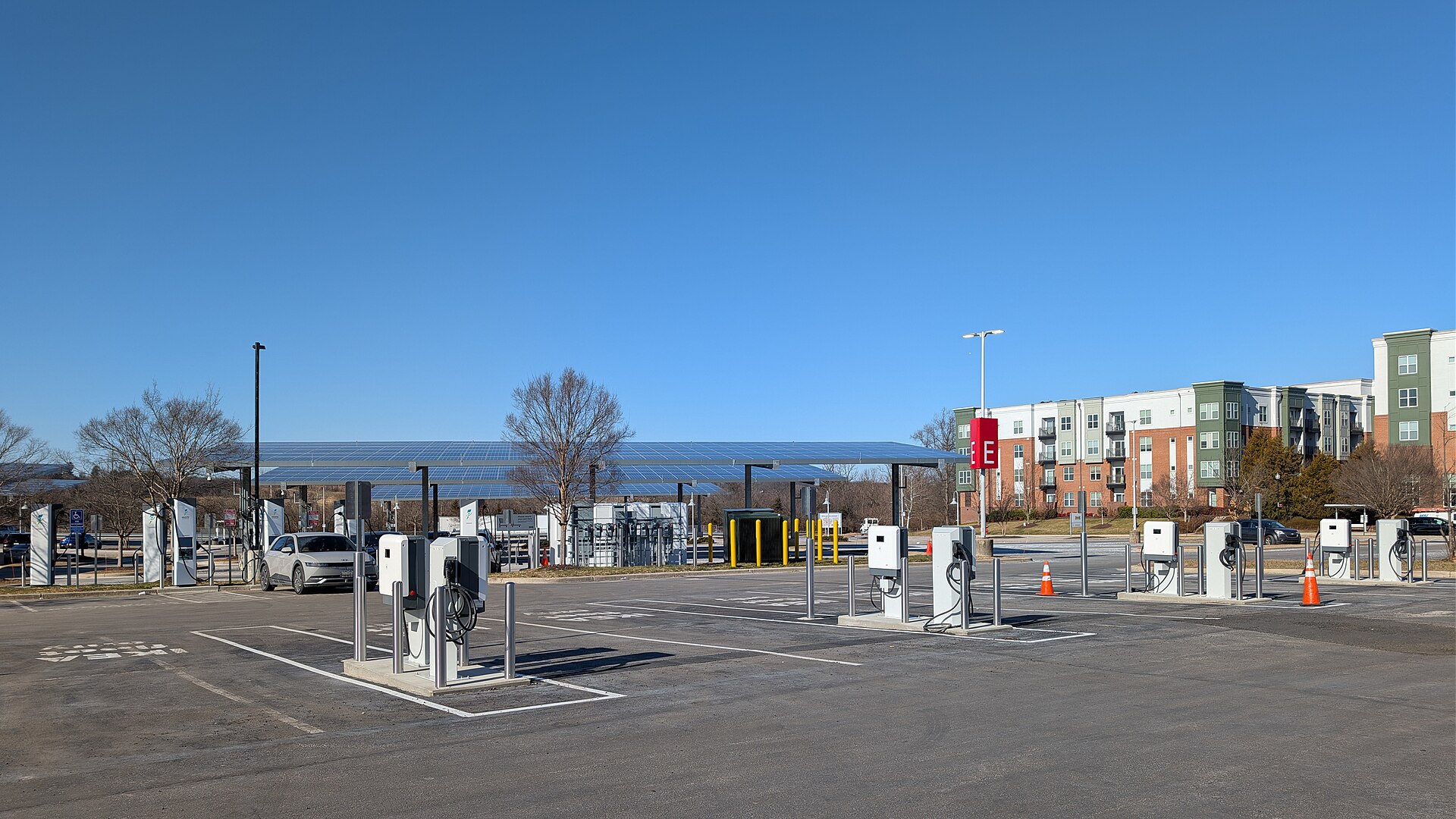 In one corner of the parking lot is an EV charging station with multiple high speed electric vehicle chargers. 10100 Baltimore Avenue, Colle