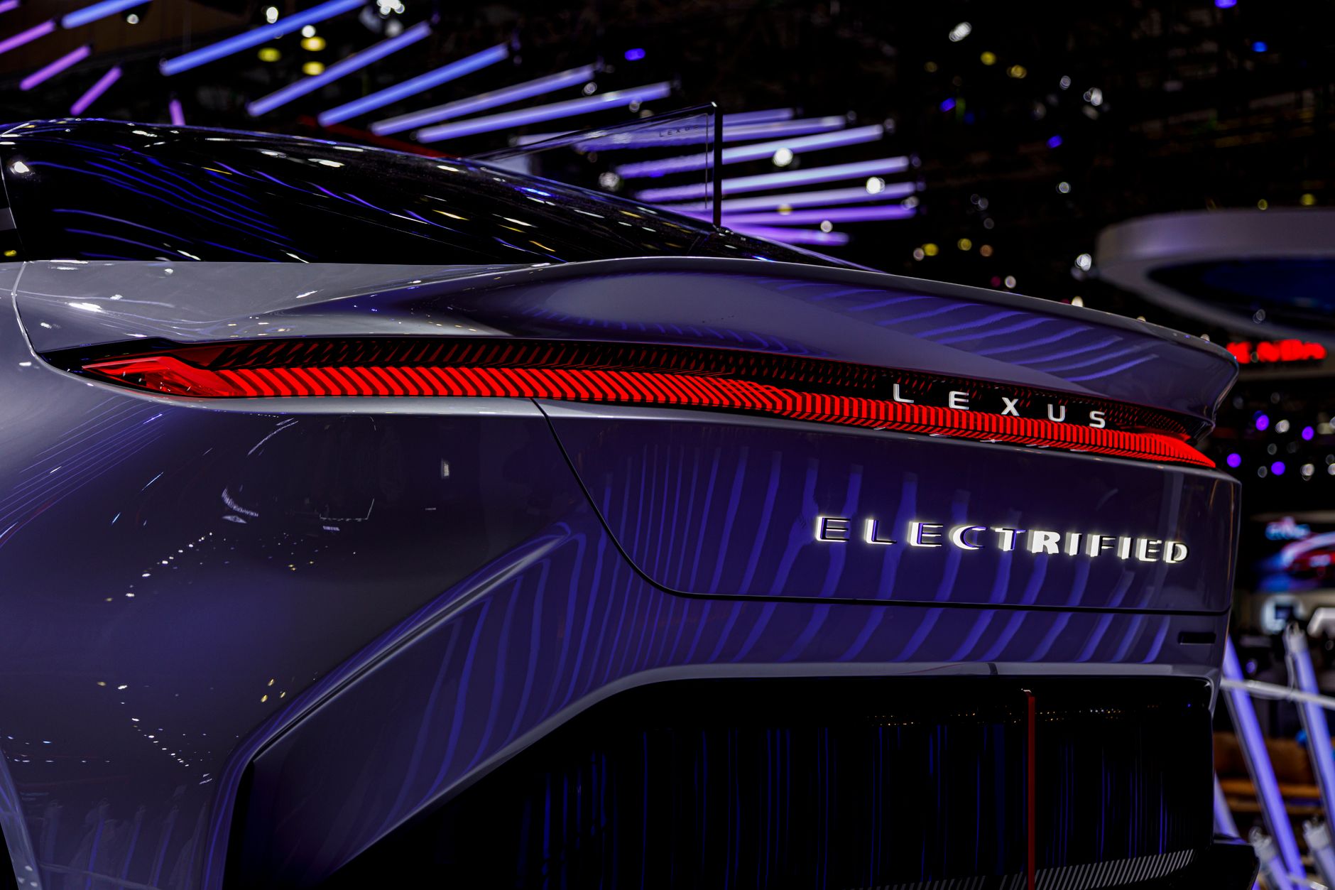 Close-up of an electrified Lexus model showcased at an automotive exhibition.