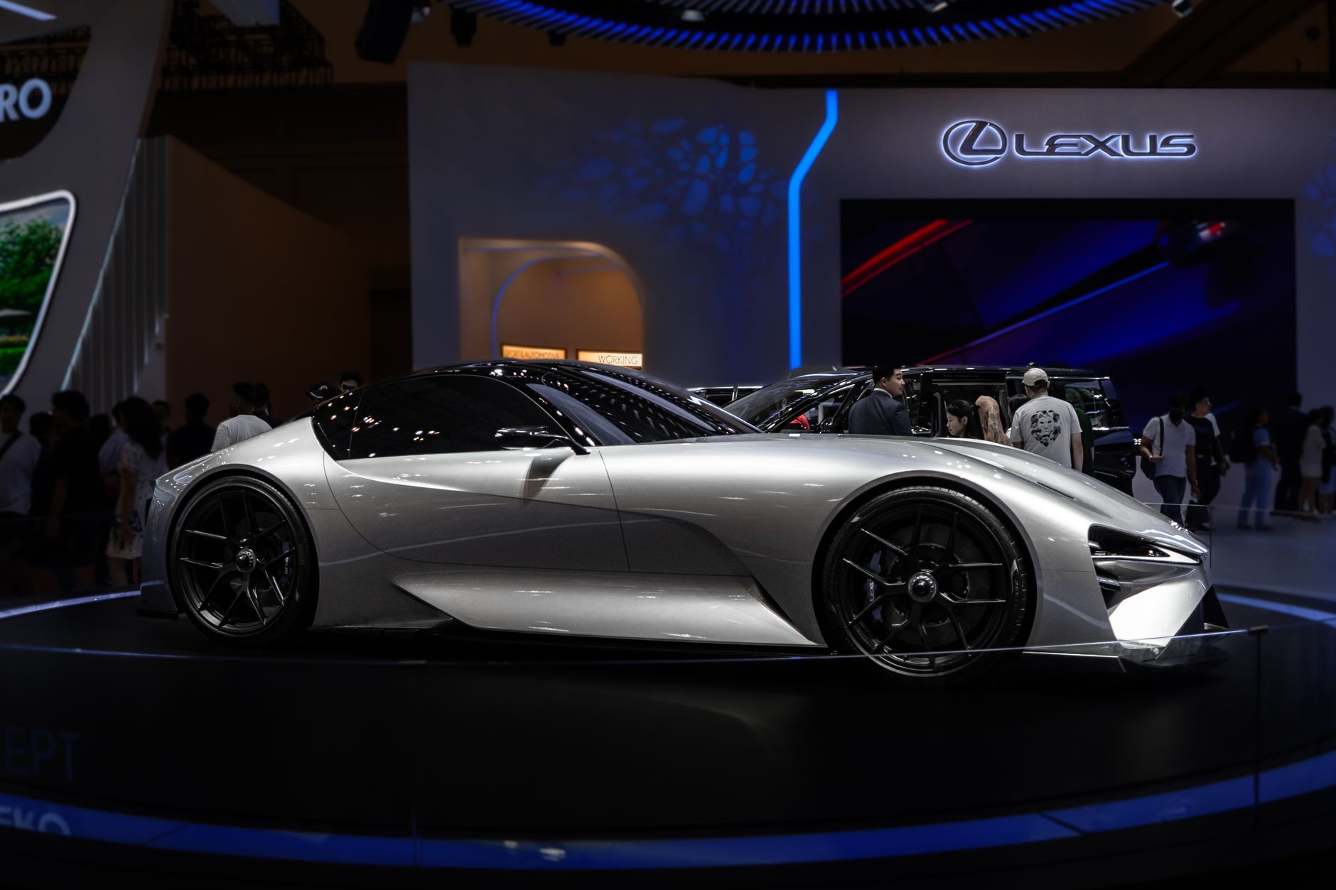Lexus concept car displayed at an indoor auto show, showcasing futuristic design.